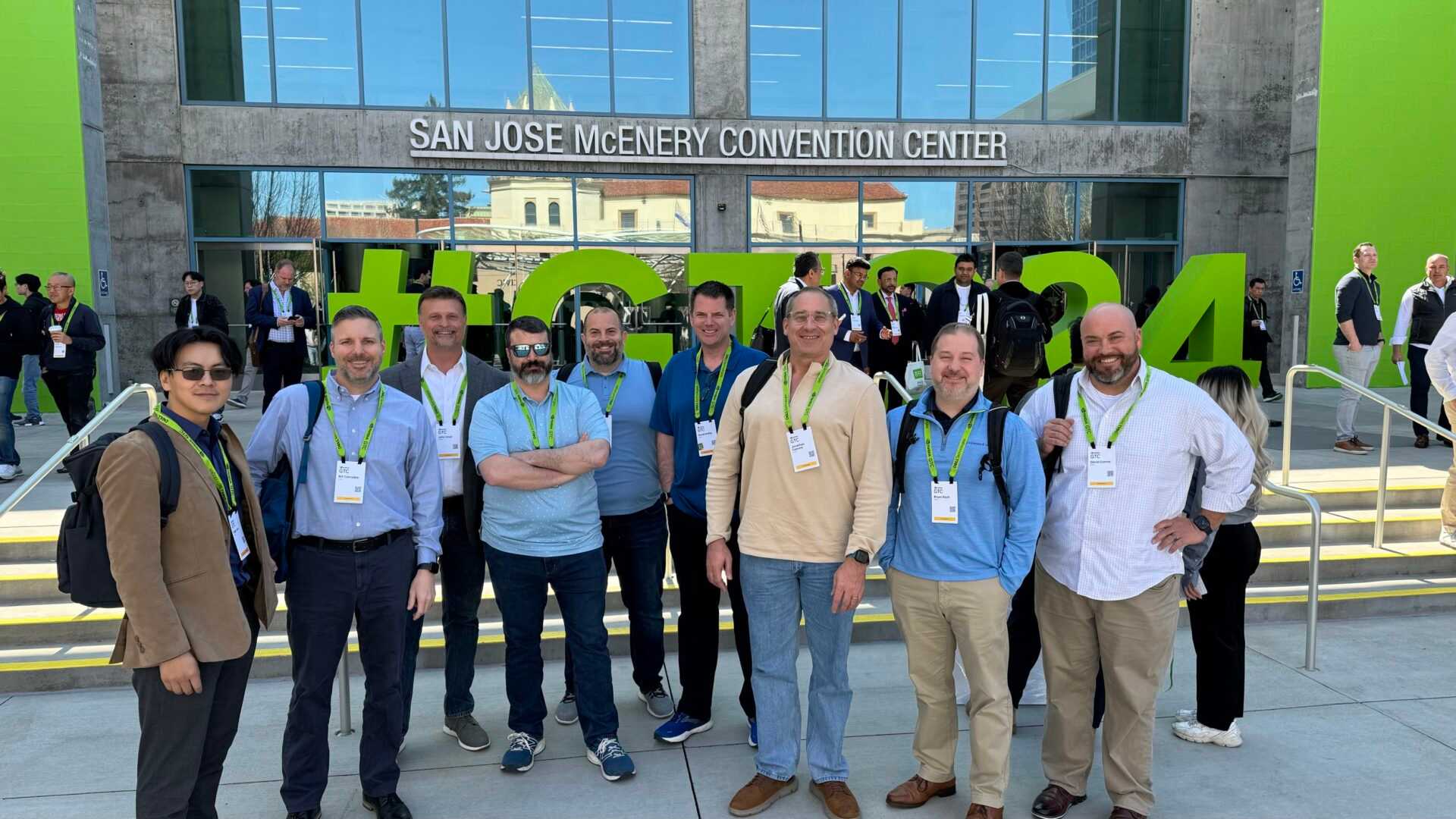 a group of people standing in front of a conference center