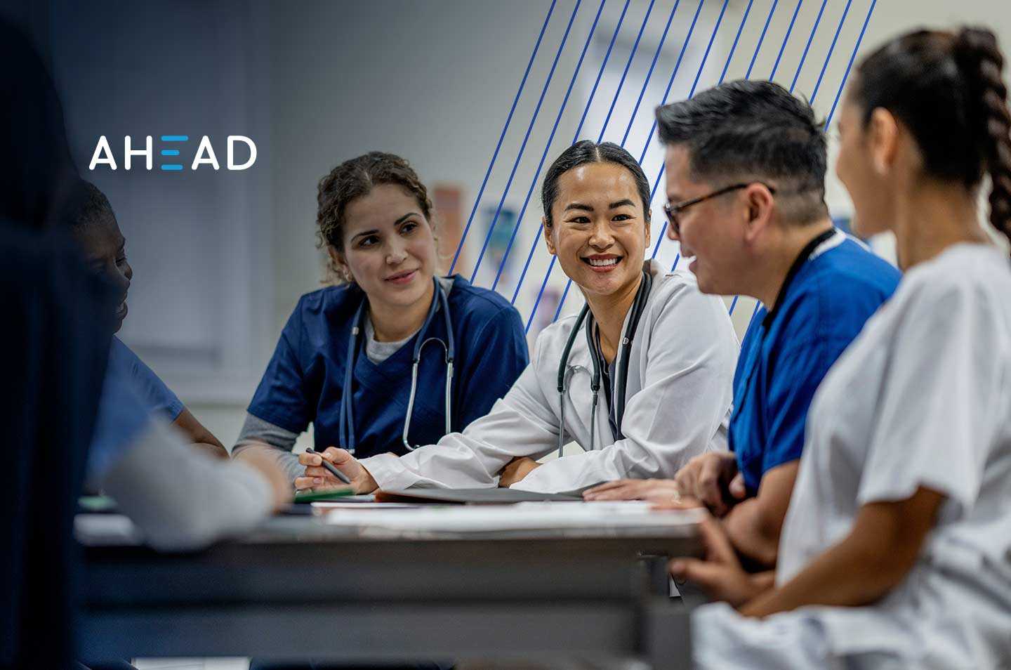 a group of medical professionals sitting at a table