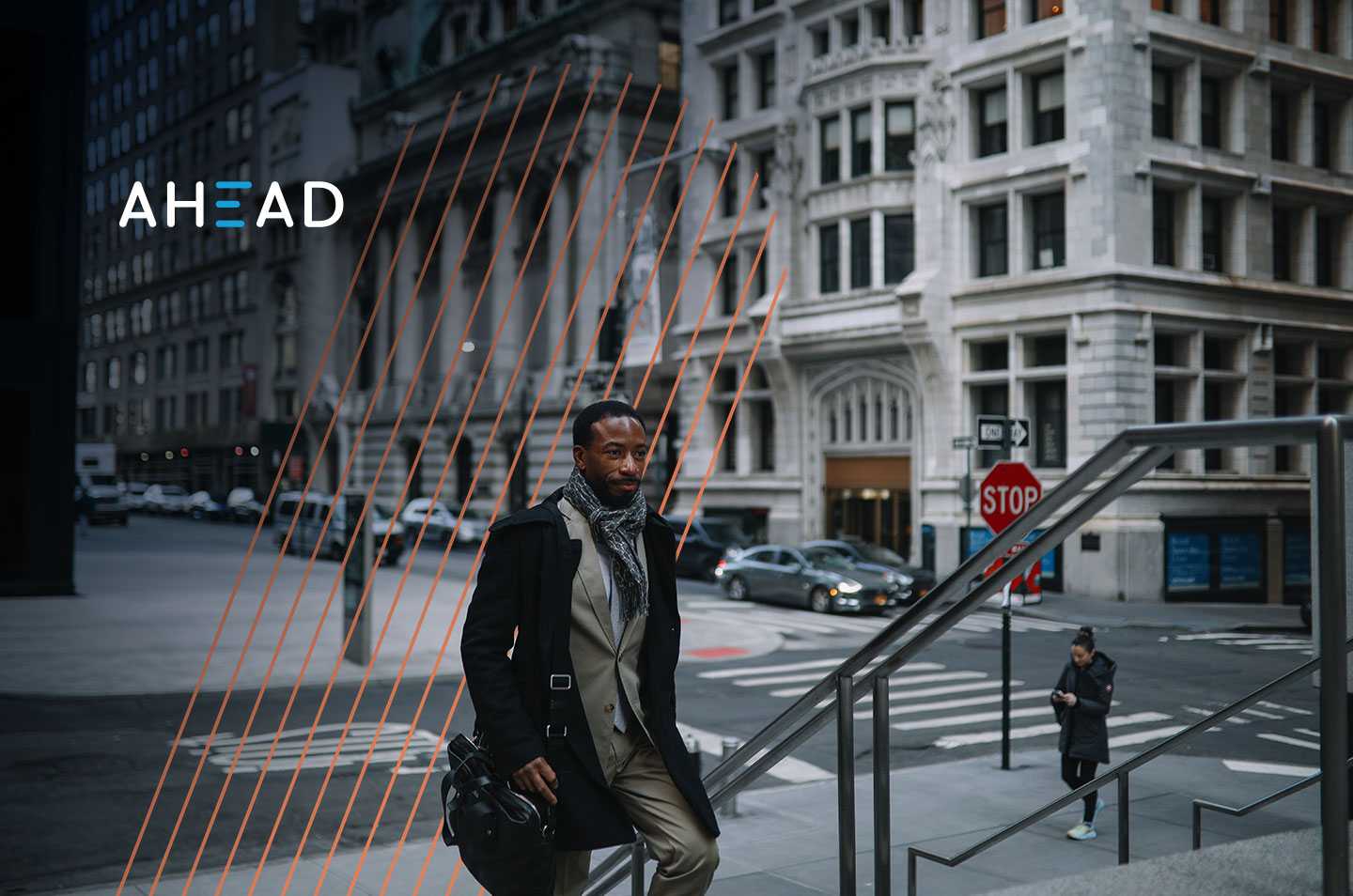a man walking up a flight of stairs in a city